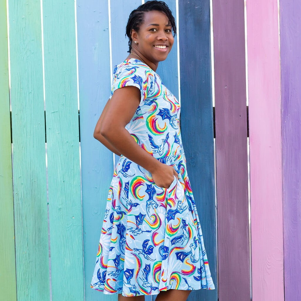 Princess Awesome & Boy Wonder Adult Rainbow Breathing Dragons Super Twirler Dress with Pockets — Princess Awesome & Boy Wonder branding close-up