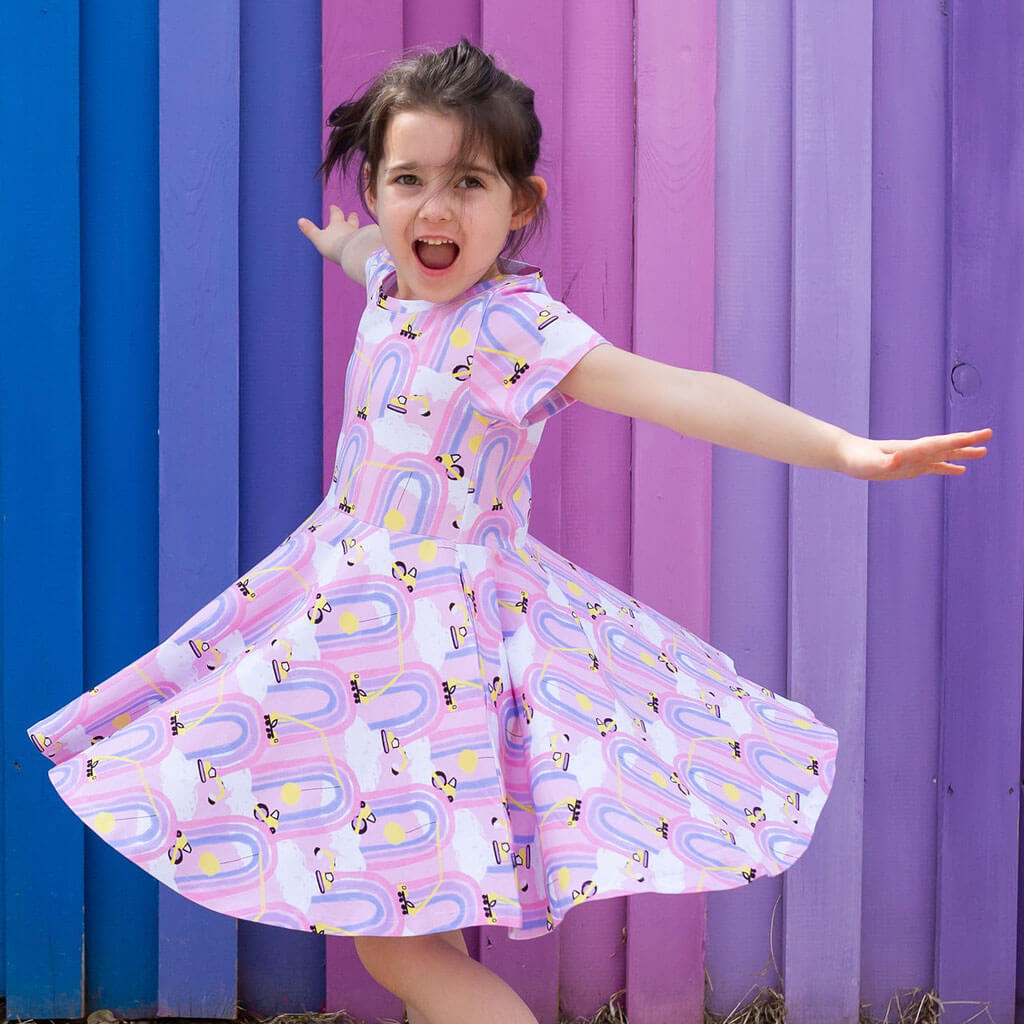 Princess Awesome & Boy Wonder "Rainbow Roadwork" Construction Trucks Super Twirler Dress with Pockets — Princess Awesome & Boy Wonder branding close-up