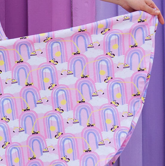 Princess Awesome & Boy Wonder Adult "Rainbow Roadwork" Construction Trucks Super Twirler Dress with Pockets — Princess Awesome & Boy Wonder branding close-up