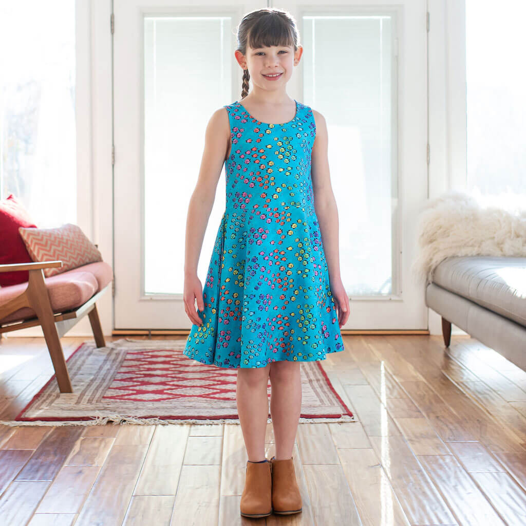 Princess Awesome & Boy Wonder "Summer School" Rainbows of Fish Sleeveless Play Dress with Pockets — Princess Awesome & Boy Wonder branding close-up