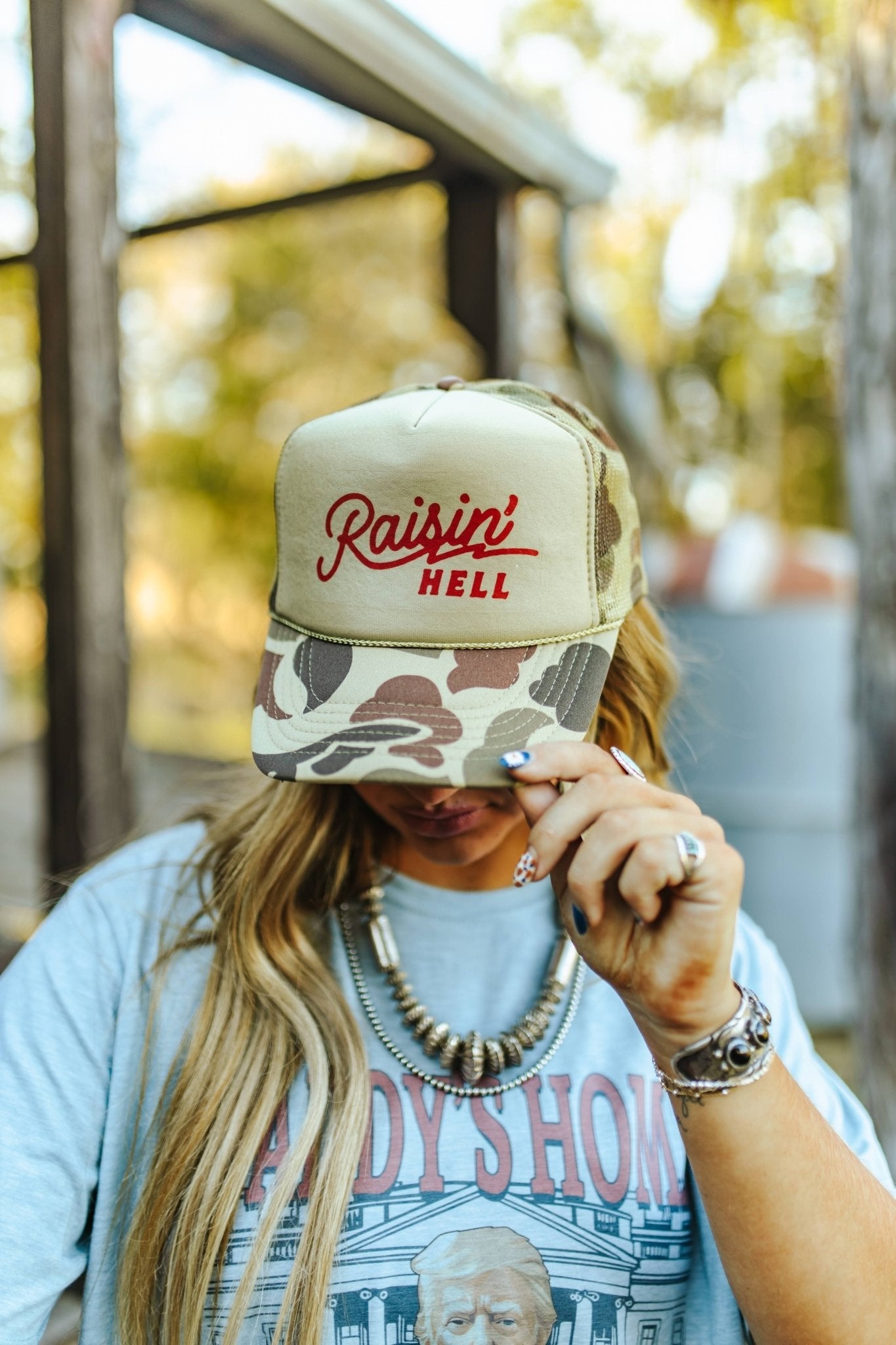 Wild Junkie Raisin' Hell Green Camo Trucker Hat — side view