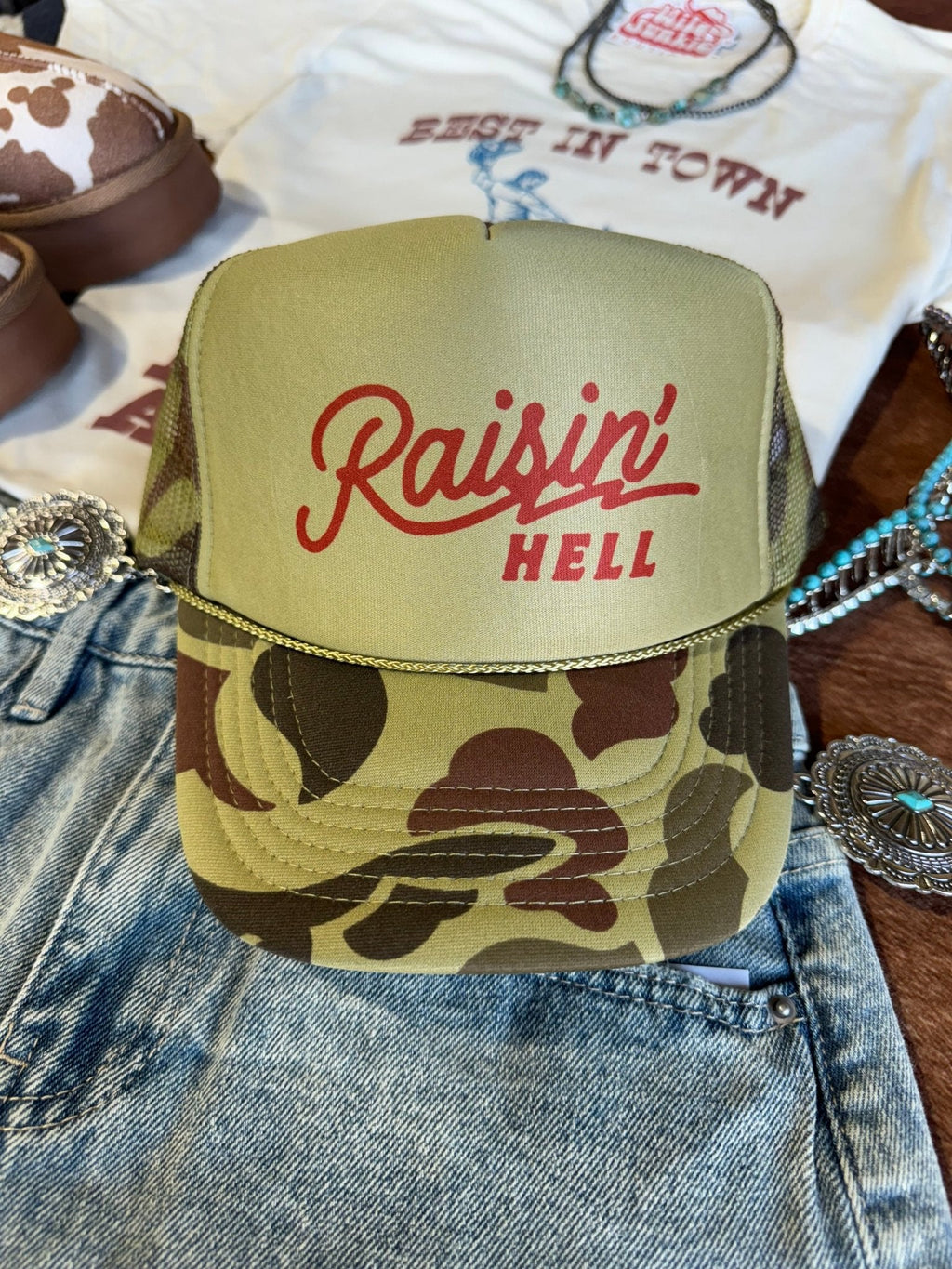 Wild Junkie Raisin' Hell Green Camo Trucker Hat — main product shot