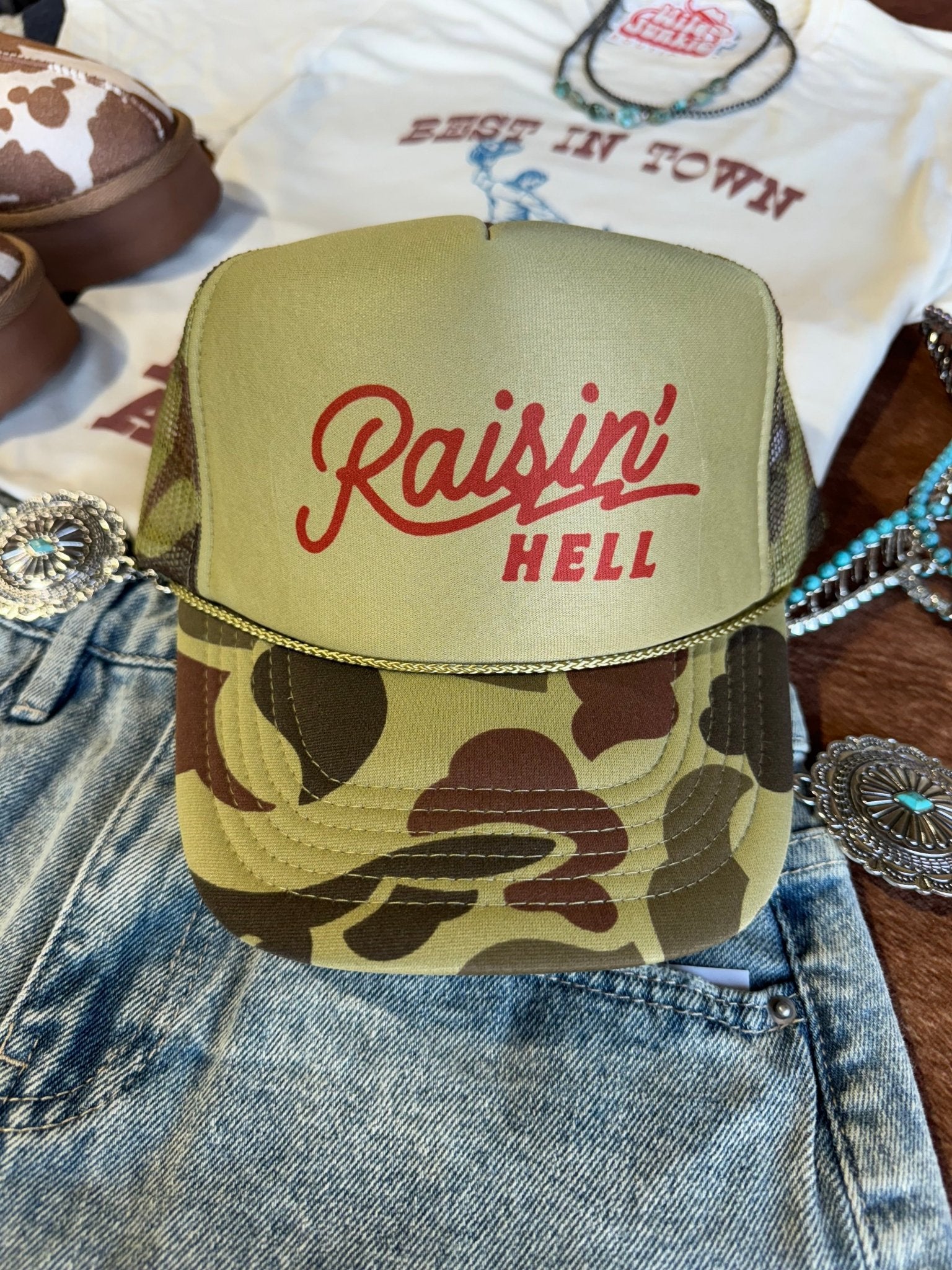 Wild Junkie Raisin' Hell Green Camo Trucker Hat — main product shot