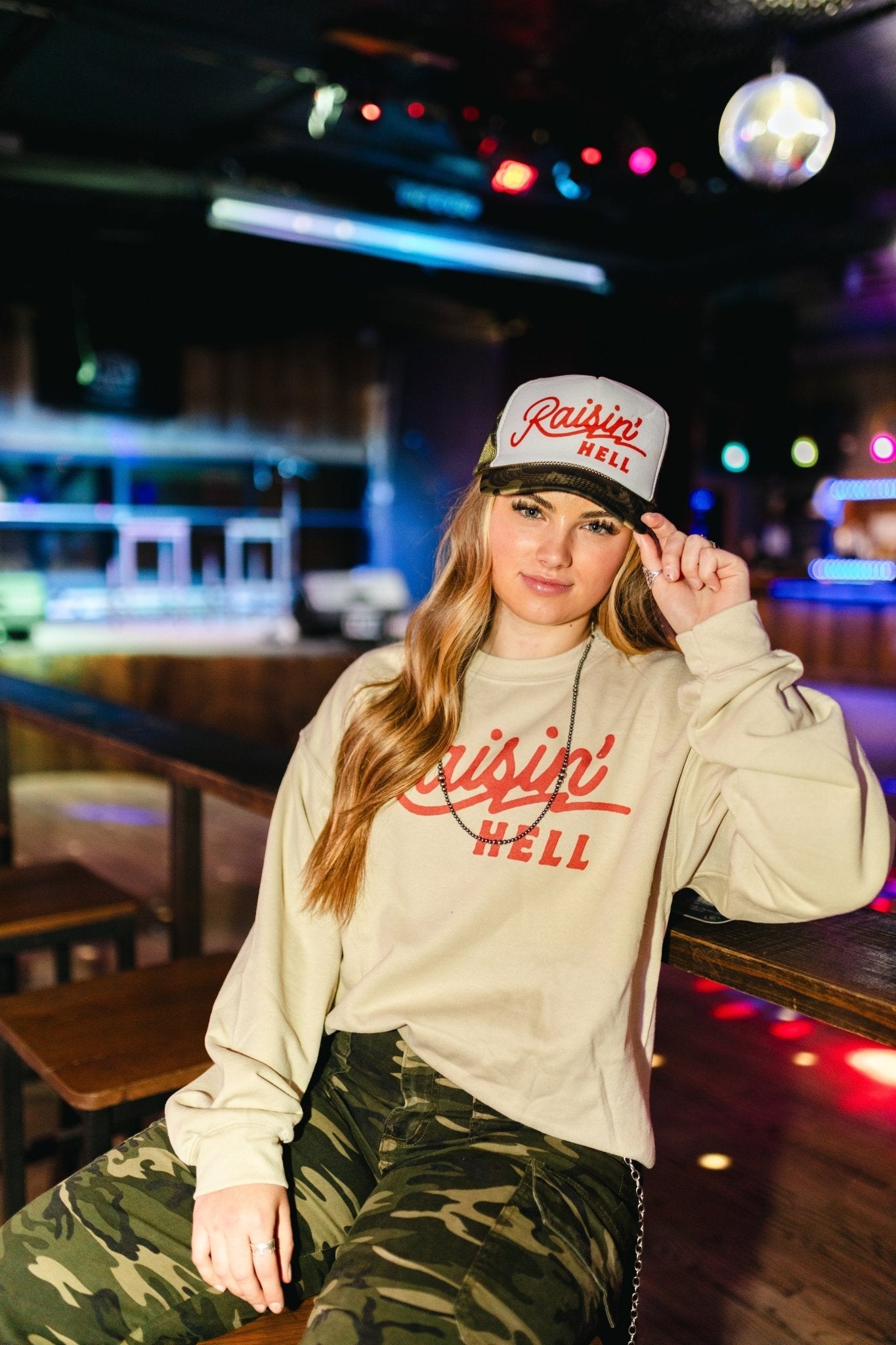 Wild Junkie Raisin' Hell Trucker Hat — lifestyle context