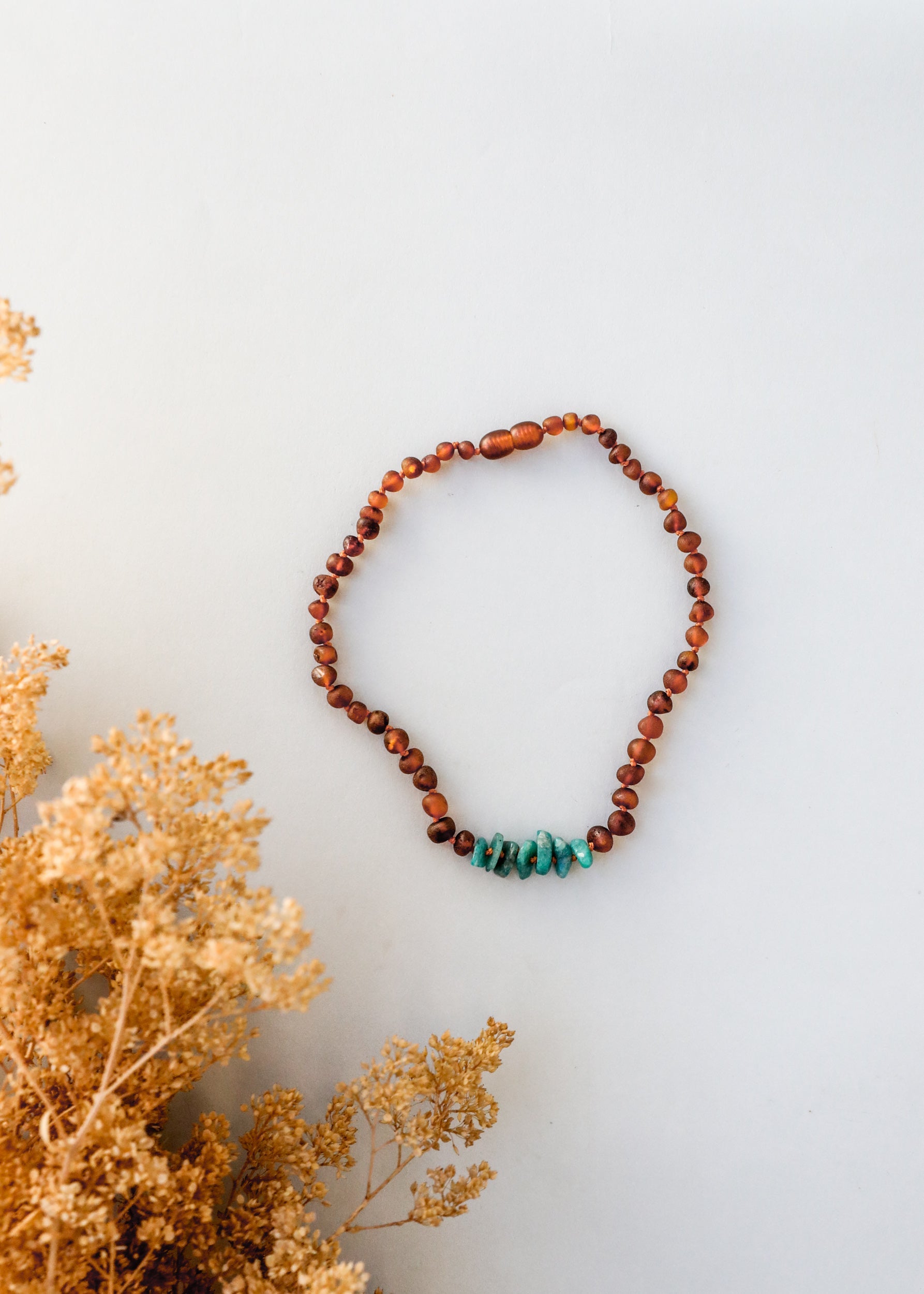 CanyonLeaf Raw Cognac Baltic Amber + Raw Amazonite || Necklace — CanyonLeaf branding close-up