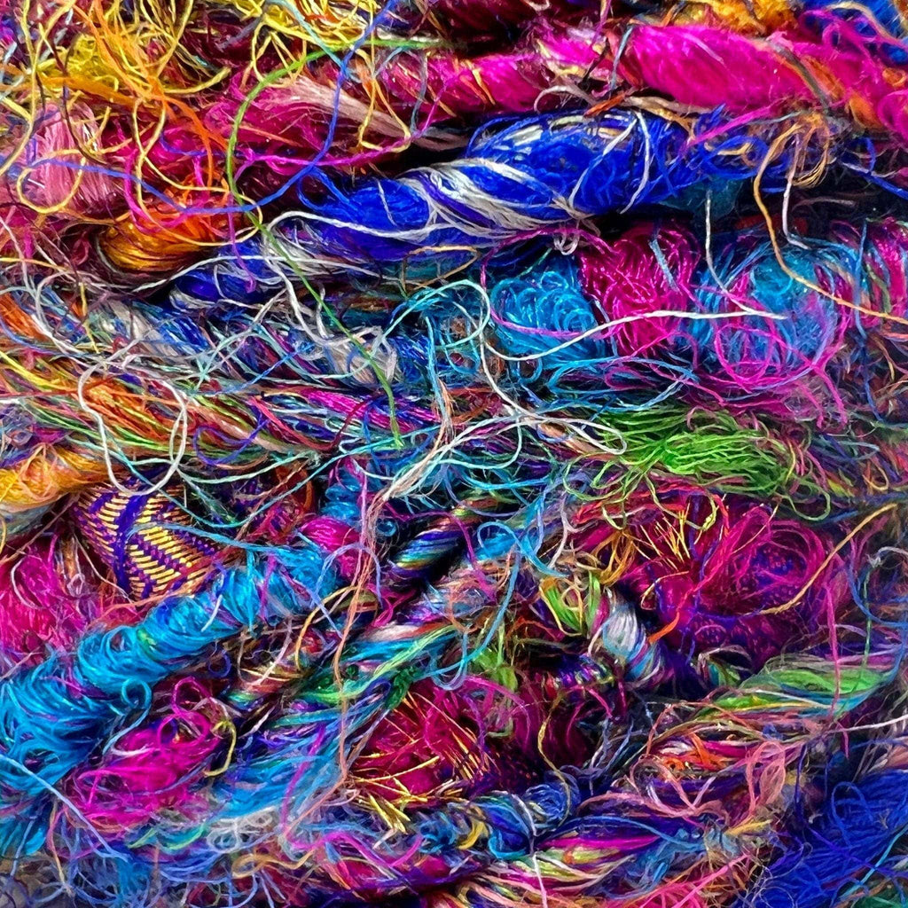 Darn Good Yarn Darn Good Yarn Recycled Silk Yarn Worsted Weight "Wild Peacock" — lifestyle worn / used context