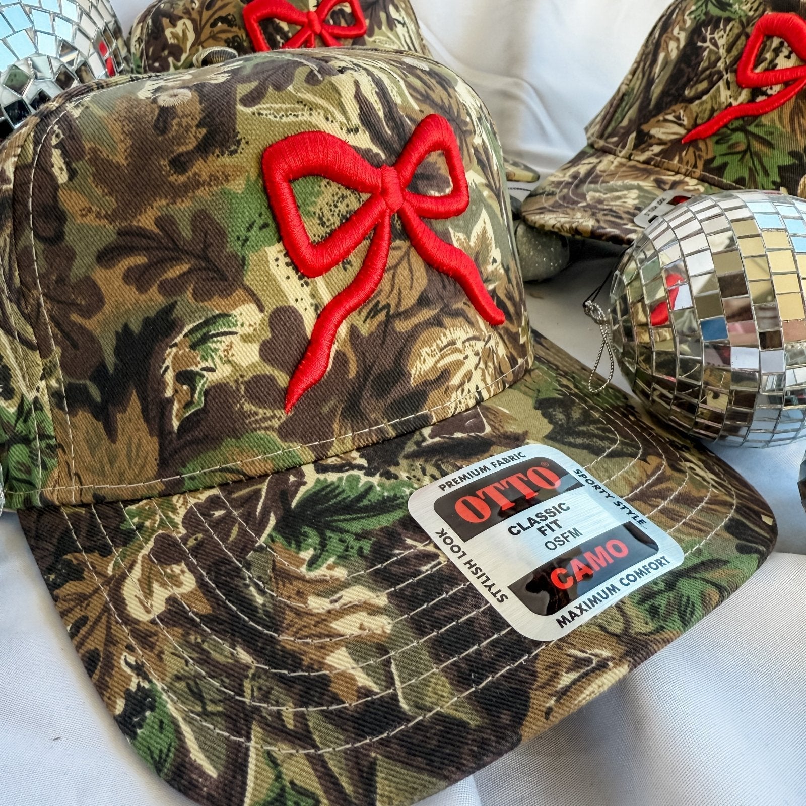 Coco & Rho Red Bow Camo- Trucker Hat — detail close-up