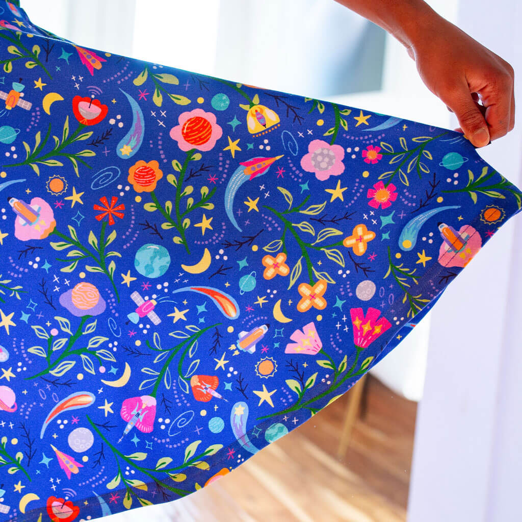 Princess Awesome & Boy Wonder "Gardeners of the Galaxy" Space Paisley Sleeveless Play Dress with Pockets — Princess Awesome & Boy Wonder branding close-up