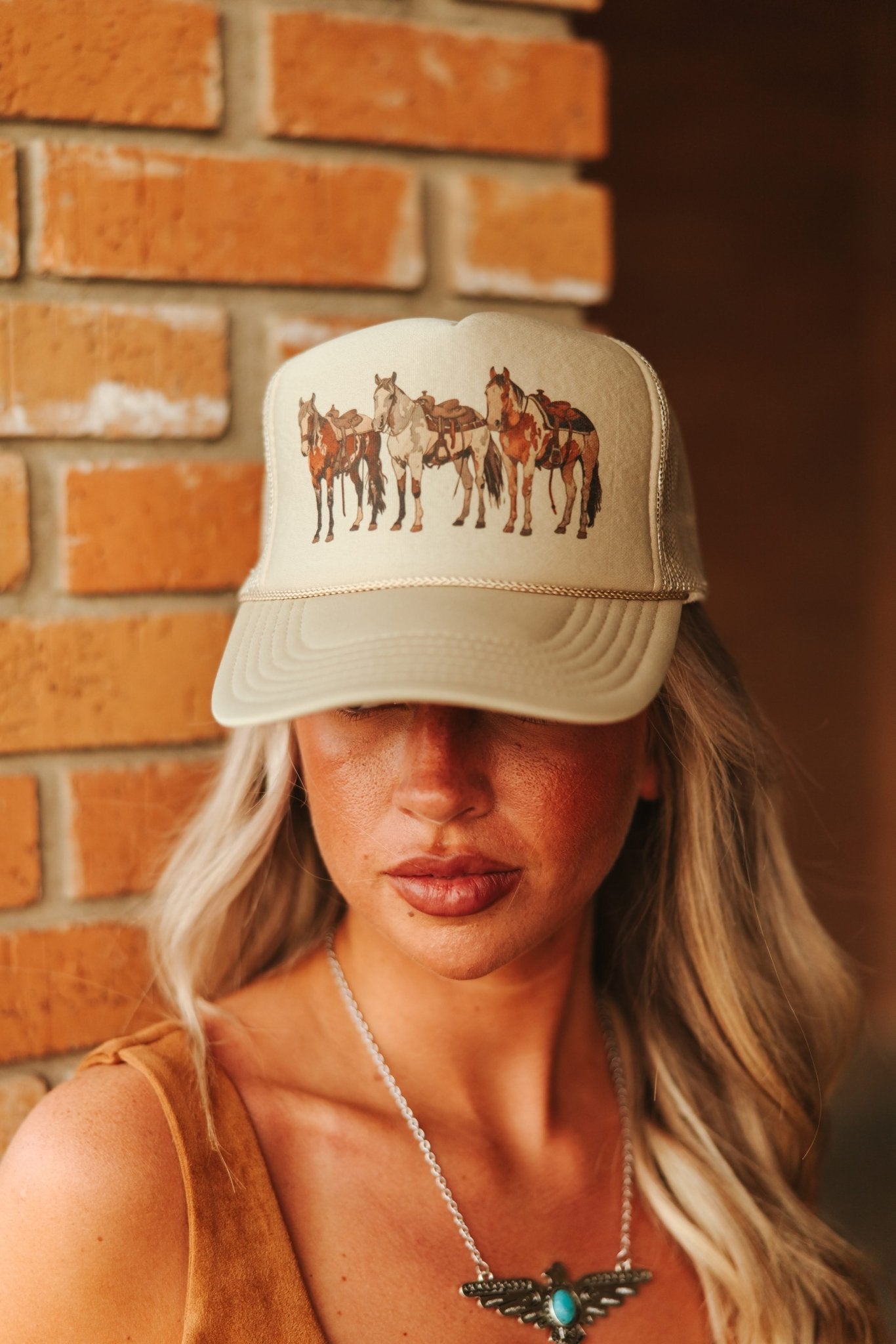 Wild Junkie Saddled Horses Trucker Hat — detail close-up