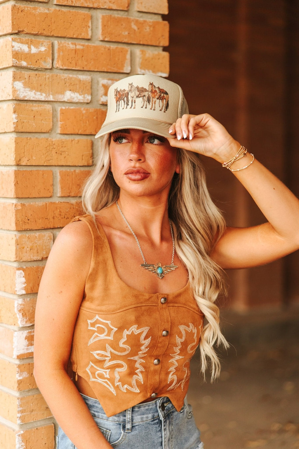 Wild Junkie Saddled Horses Trucker Hat — lifestyle context