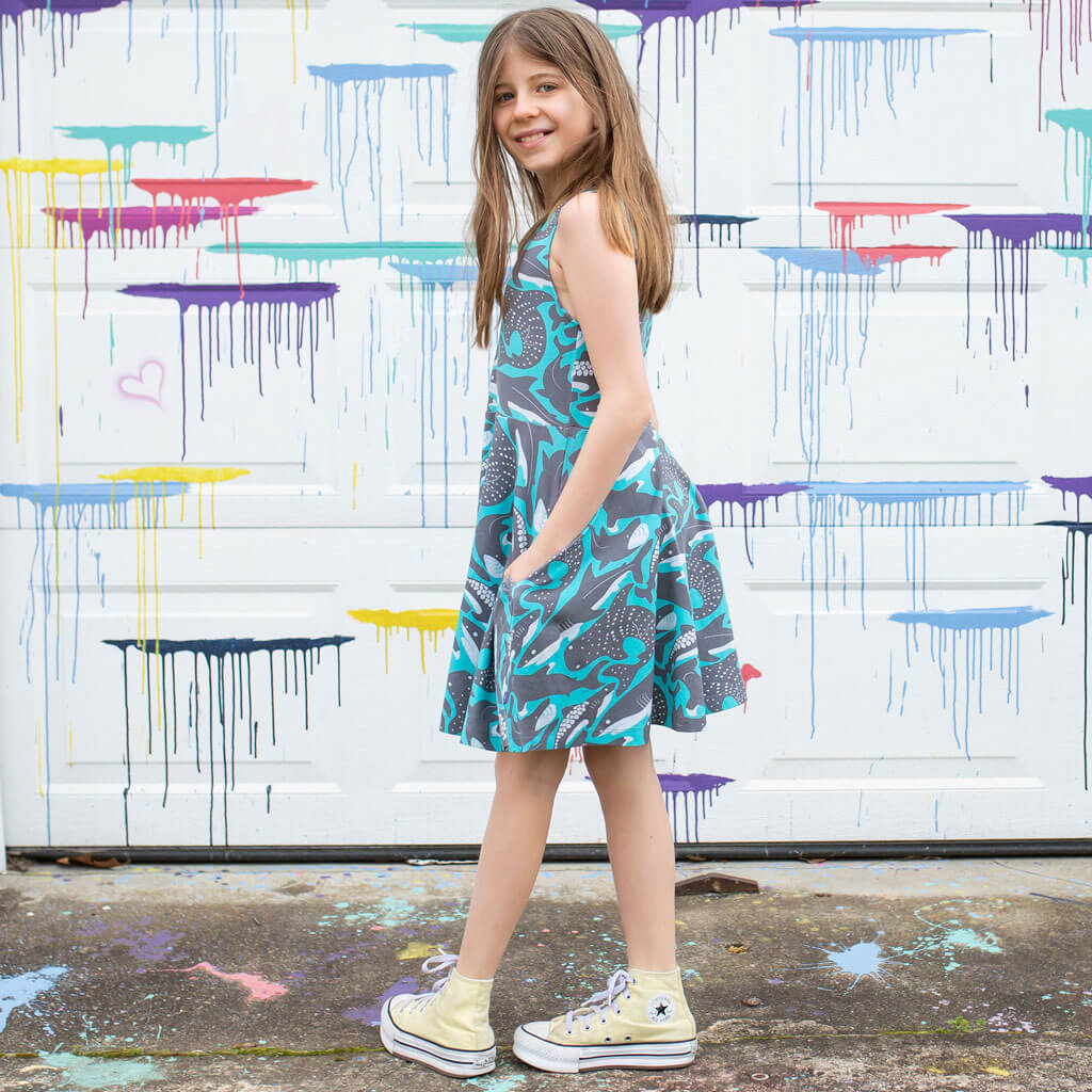 Princess Awesome & Boy Wonder "Megabites" Sharks Sleeveless Play Dress with Pockets — Princess Awesome & Boy Wonder branding close-up