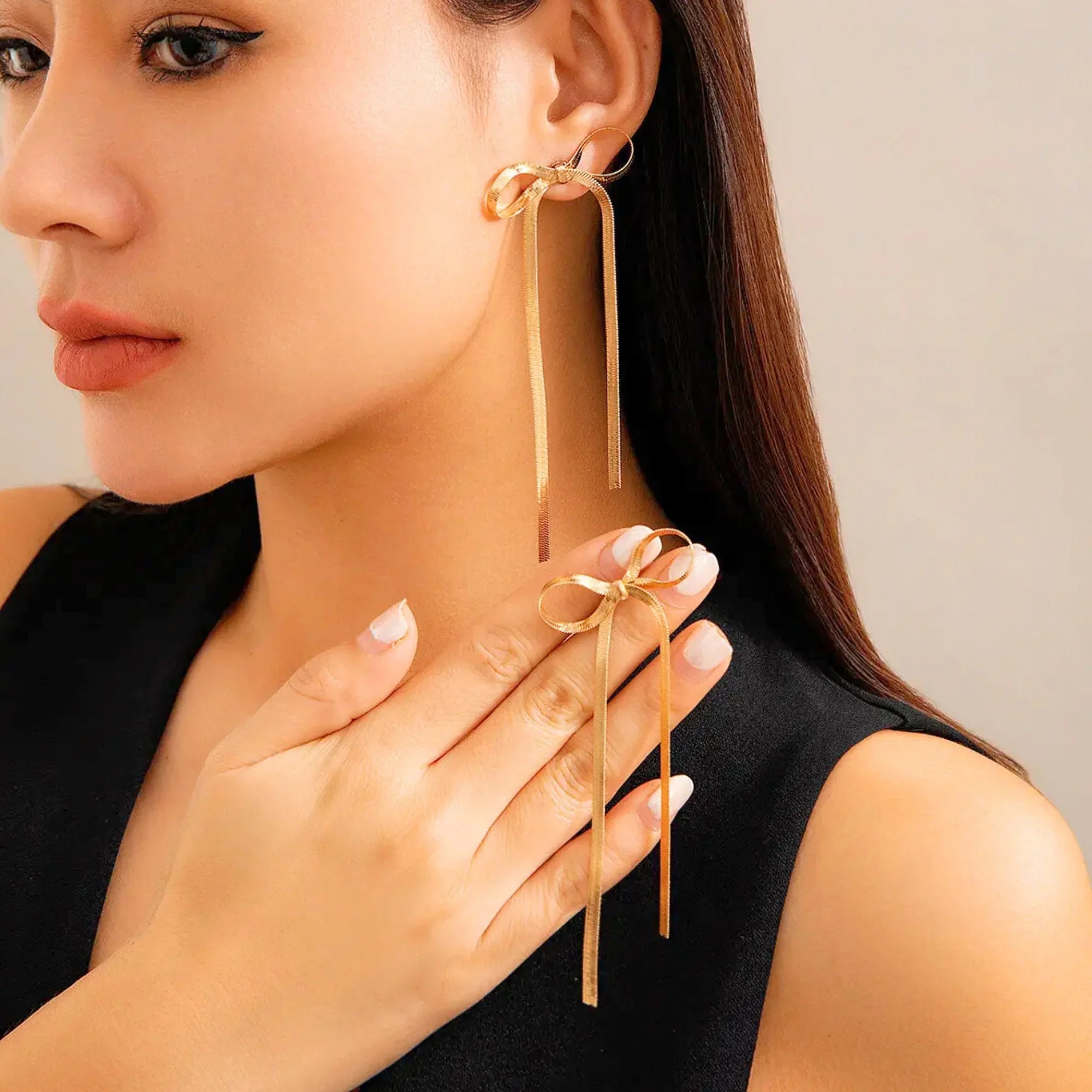 SORI STYLE Golden Bow Knot Drop & Dangle Earrings — detail close-up