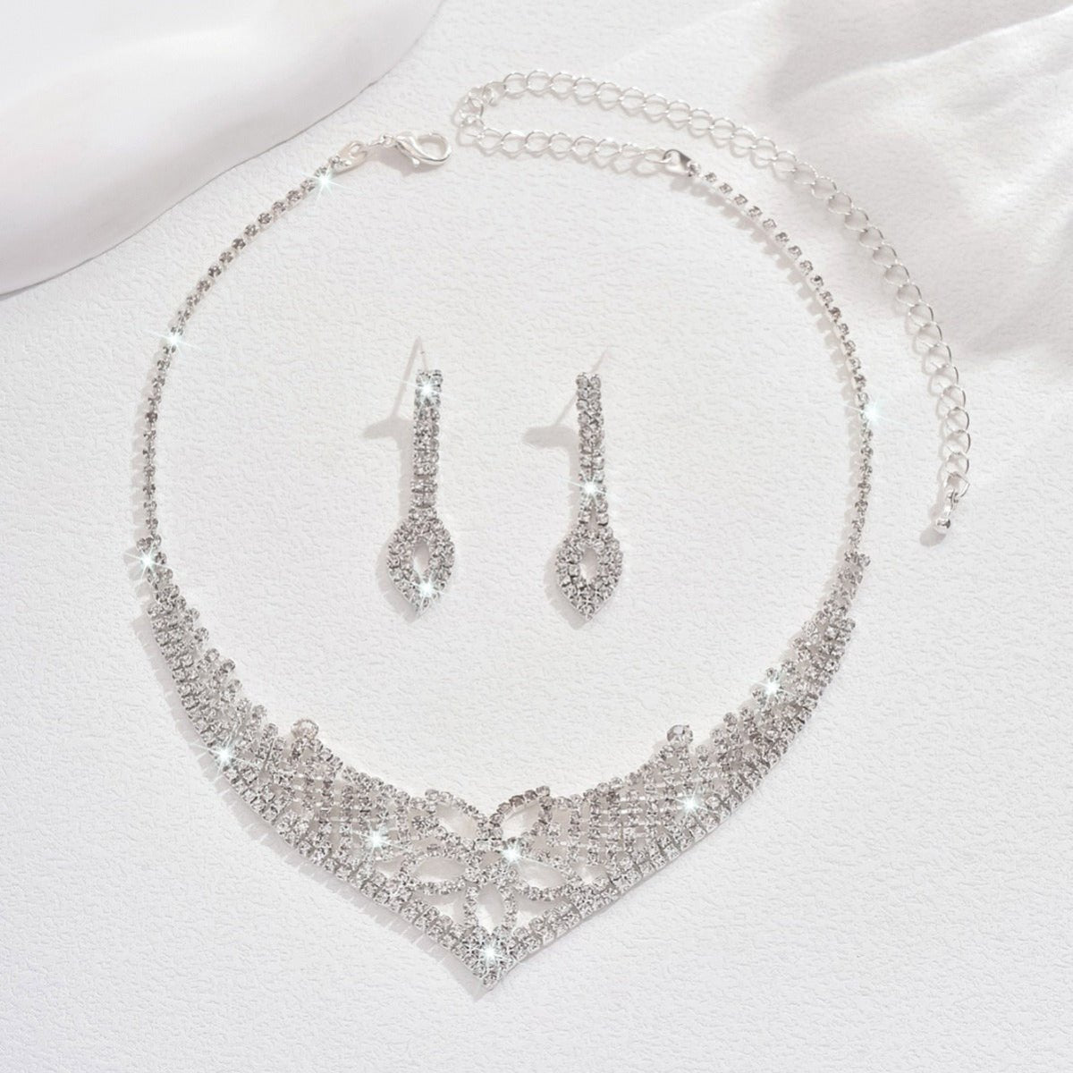 Mariam's Collection Sparkling Rhinestone Trio Earrings Necklace Bracelet Collection (MAC315) — Mariam's Collection branding close-up
