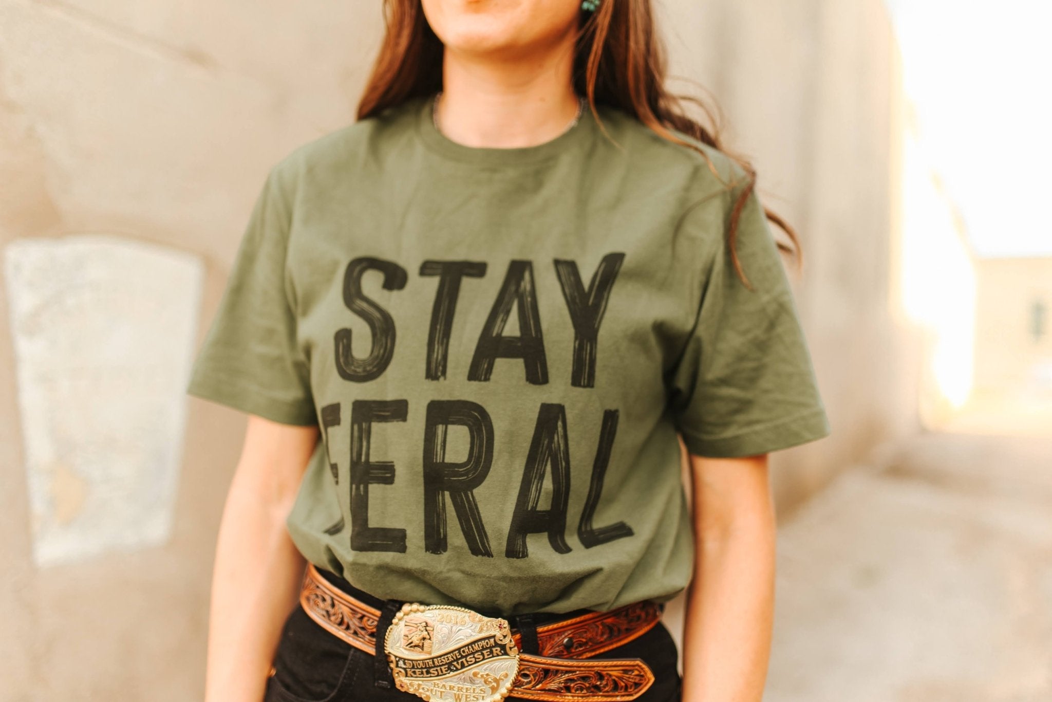 Wild Junkie Stay Feral Graphic Tee — Wild Junkie branding close-up