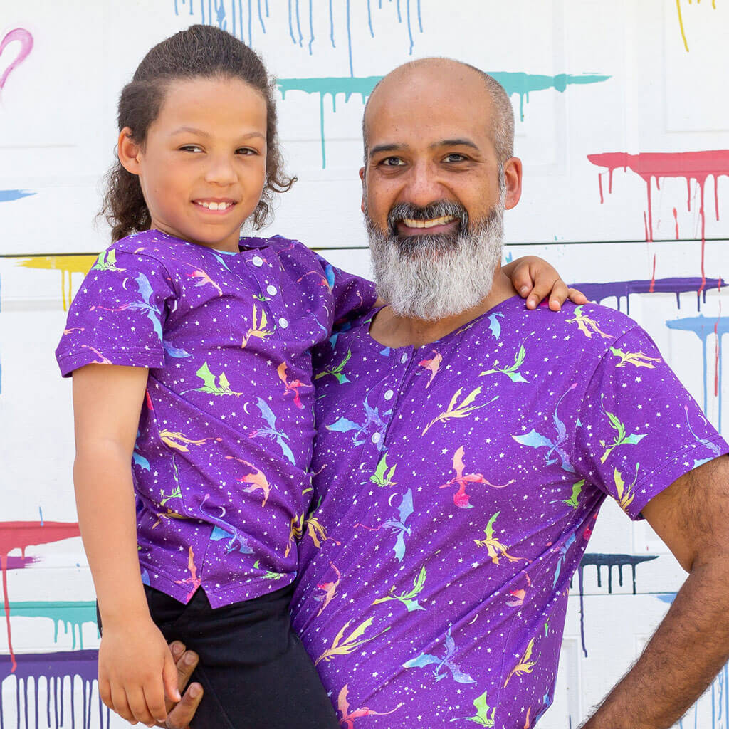 Princess Awesome & Boy Wonder "Star Fire" Stellar Dragons Henley Short Sleeve Tee — Princess Awesome & Boy Wonder branding close-up