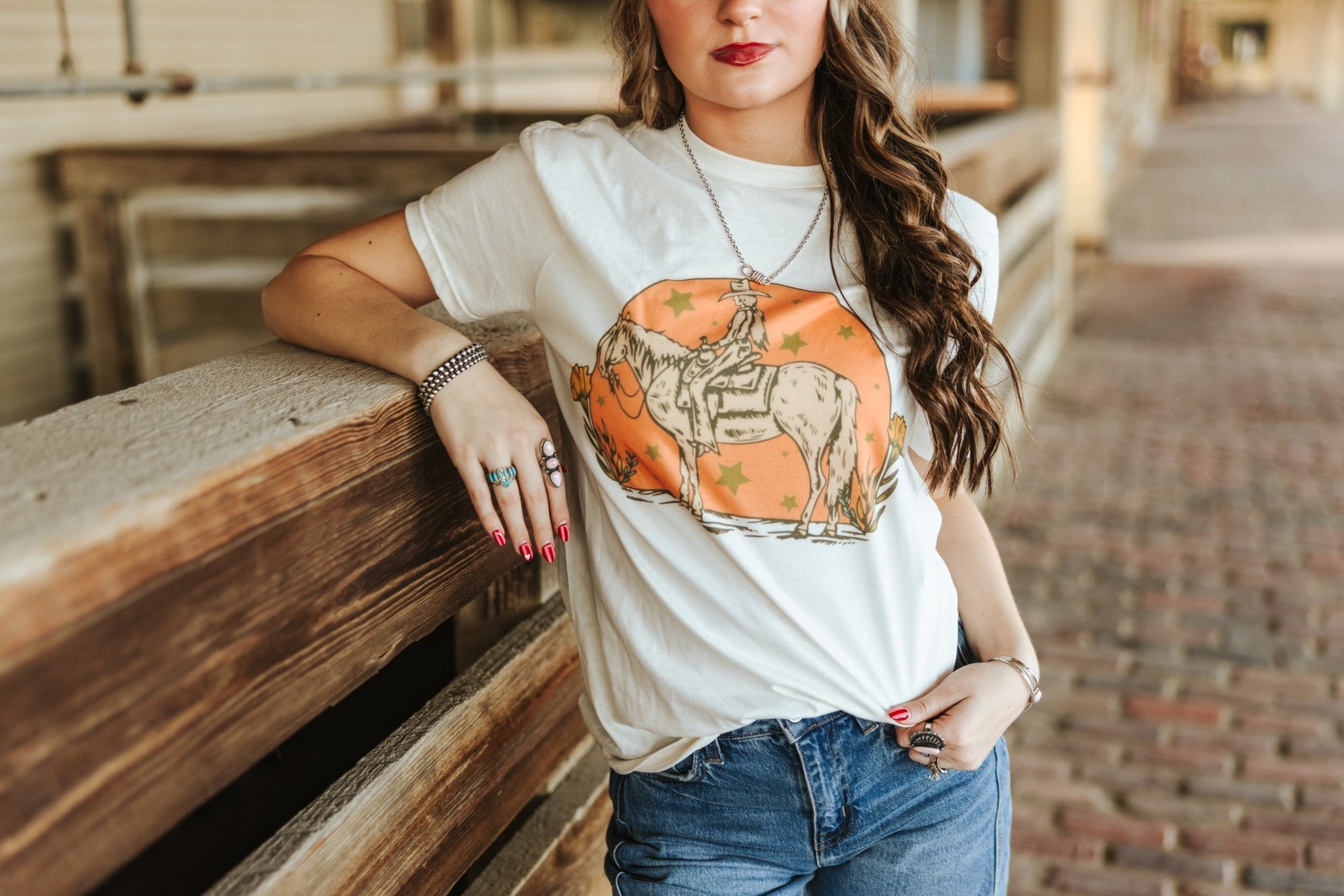 Wild Junkie Sunset Cowgirl Rider Graphic Tee — detail close-up