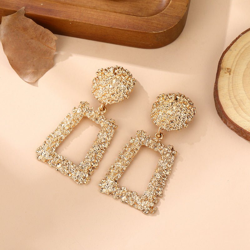 Mariam's Collection Trapezoid Dangle Earrings with Carved Texture (MAC322) — lifestyle worn / used context