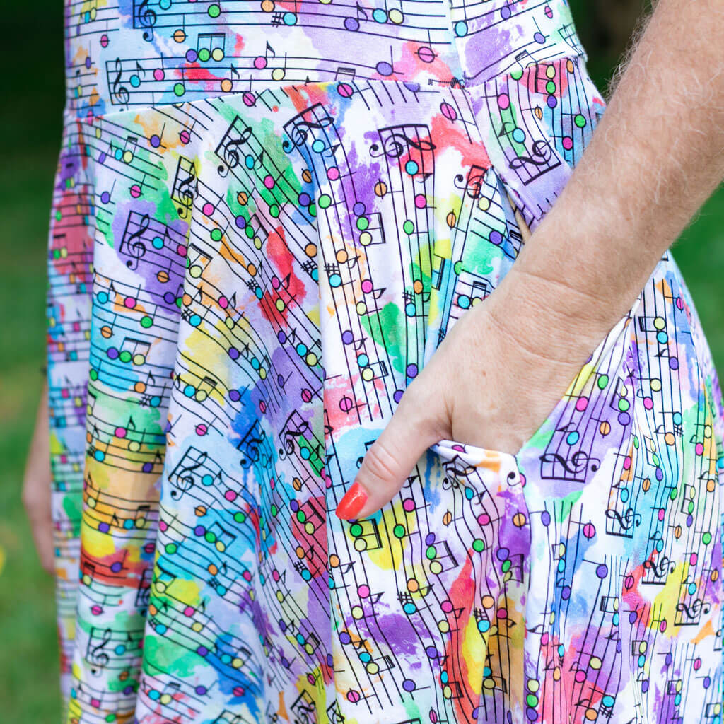 Princess Awesome & Boy Wonder Adult "Staff Meeting" Rainbow Music Notes Super Twirler Dress with Pockets — lifestyle context