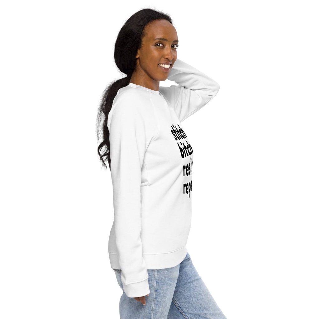 Darn Good Yarn Stitch Bitch Resist Repeat Unisex organic raglan sweatshirt — Darn Good Yarn branding close-up