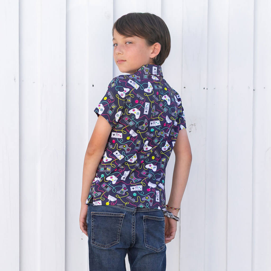 Princess Awesome & Boy Wonder Video Game Controllers Short Sleeve Polo Shirt — Princess Awesome & Boy Wonder branding close-up