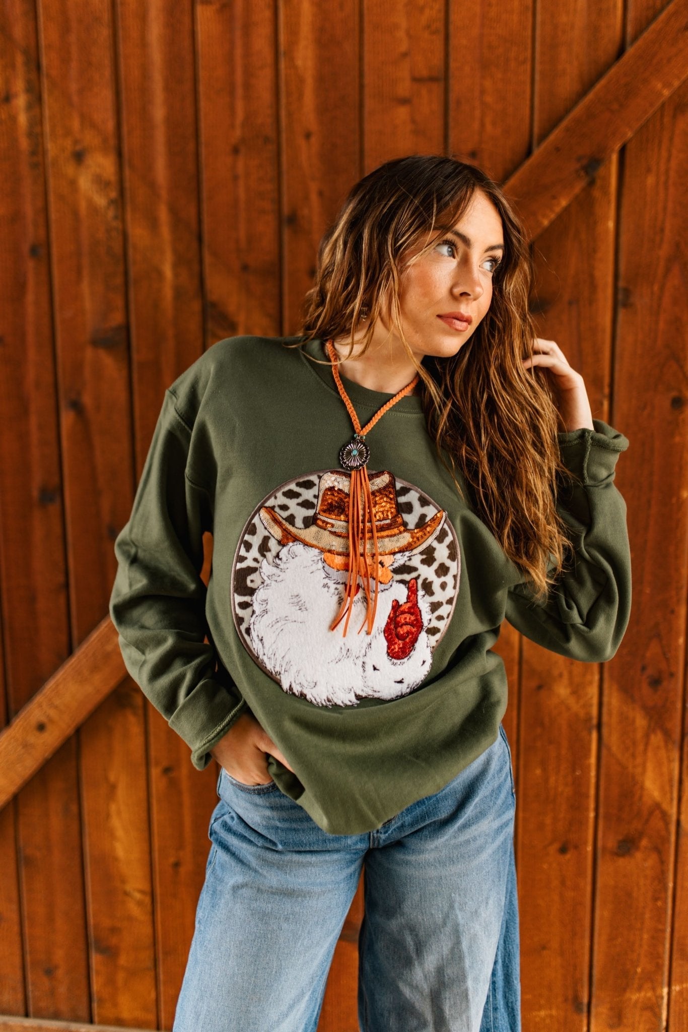 Wild Junkie Western Santa Sequin Patch Sweatshirt — Wild Junkie branding close-up