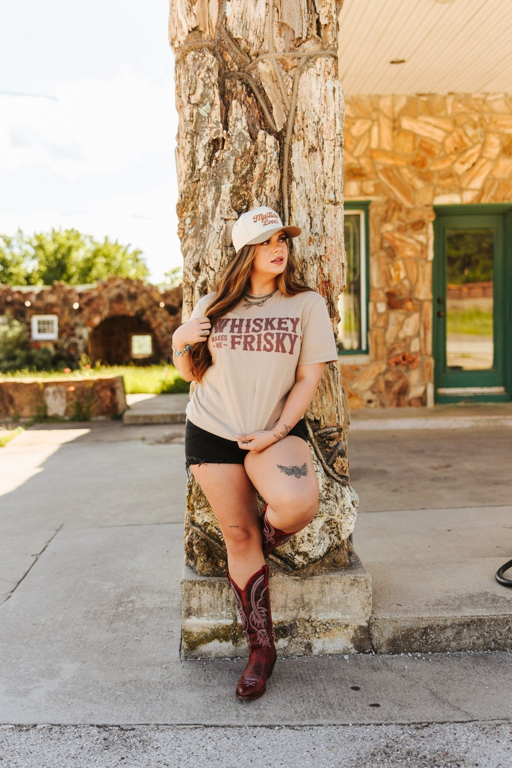 Wild Junkie Whiskey Makes Me Frisky Graphic Tee — Wild Junkie branding close-up