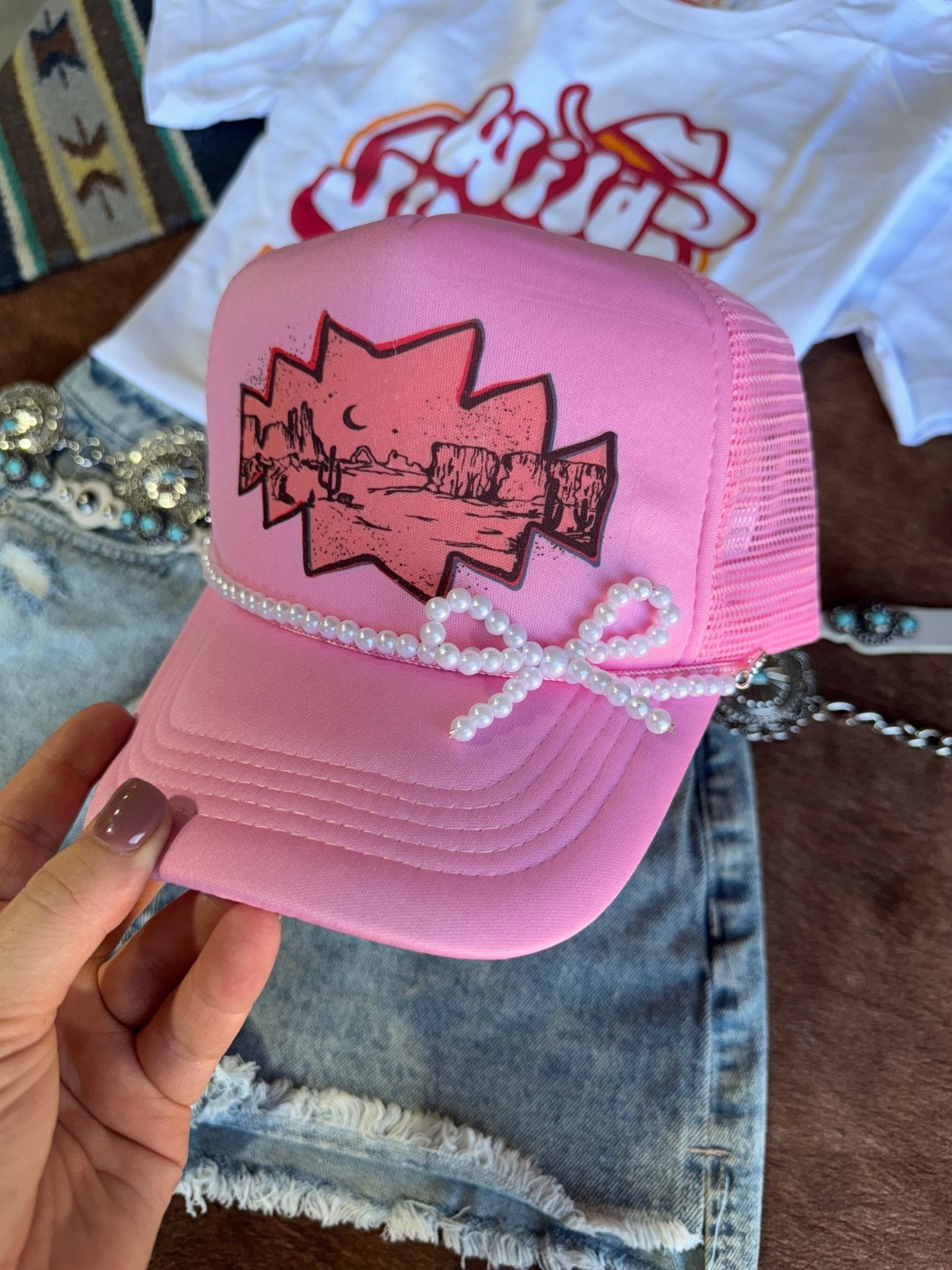 Wild Junkie White Pearl Bow Trucker Hat Chain — detail close-up