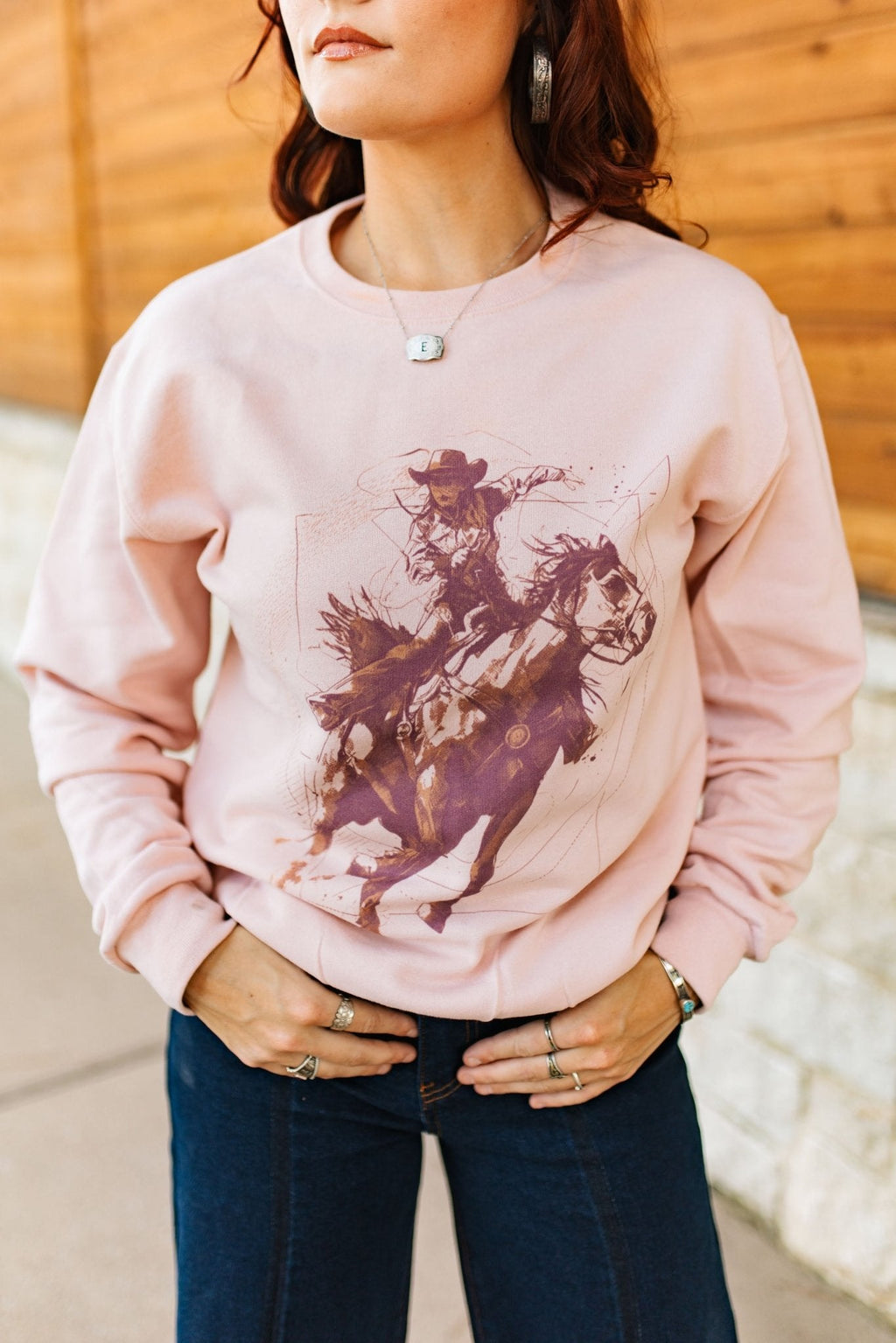 Wild Junkie Vintage Modern Cowgirl Graphic Sweatshirt — Wild Junkie branding close-up