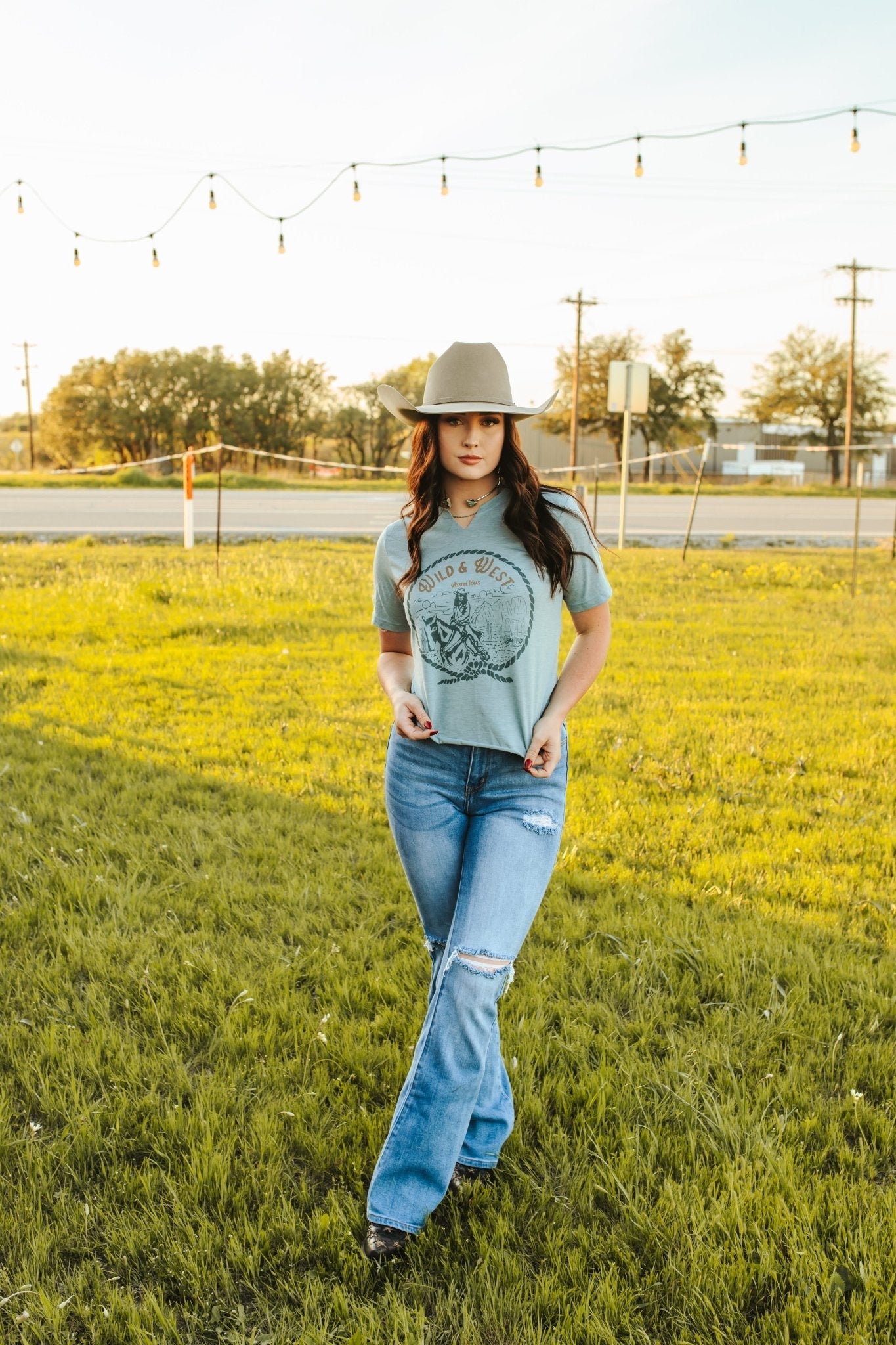Wild Junkie Wild & West Raw Cut Hem and V-neck Graphic Tee — Wild Junkie branding close-up